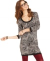 Add some pop to your look with this fun geometric print sweater dress from Material Girl!