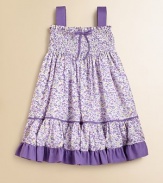 With two gorgeous looks in one, this frilly, ruffled frock with removable straps and a fold-down smocked bodice will be an instant fave.SquareneckRemovable, buttoned straps for easy conversionPullover styleSmocked bodiceFull skirtRuffled hemFully linedCottonMachine wash coldImported