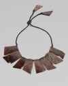 This bold, statement-making design is made up of glossy, geometric tortoise panels.HornCotton cordLength, about 8Pendant length, about 2½Imported