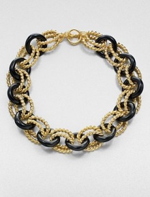 A graphic link style in 22k goldplating and glossy resin. Resin22k goldplatingLength, about 18Toggle closureMade in USA A graphic link style in 22k goldplating and glossy resin. Resin22k goldplatingLength, about 18Toggle closureMade in USA