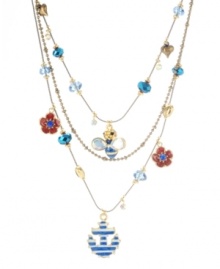 You'll be the talk of the town in Betsey Johnson's eclectic illusion necklace. This three-row design highlights a blue striped bee, red and blue flower charms, and a blue and white striped anchor. Crafted in gold tone mixed metal with cherry bead and crystal accents. Approximate length: 16 inches + 3-inch extender. Approximate drop: 3-3/4 inches.