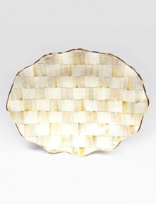 This remarkably unique platter, in hand-painted terra cotta with color-dragged checks and golden trim, creates an ultra-glamorous presentation piece for your guests.Ceramic with golden lustre16 X 22Hand washMade in the USA This remarkably unique platter, in hand-painted terra cotta with color-dragged checks and golden trim, creates an ultra-glamorous presentation piece for your guests.Ceramic with golden lustre16 X 22Hand washMade in the USA
