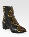 An exotic print defines this classic ankle boot crafted of textured leather with a smooth patent-covered heel. Patent leather heel, 2 (50mm)Snake-print leather upperSide zipLeather lining and solePadded insoleImported