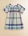 Charming open checks on a blown-up scale, in bright colors on loosely woven, textured cotton.Square neckline with wide bandShort kimono sleeves with banded cuffsPleated babydoll waistBack buttonsButton side-seam pocketsCottonMachine washImported Please note: Number of buttons may vary depending on size ordered. 