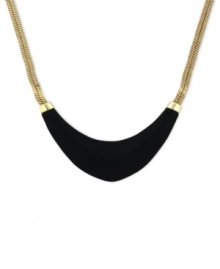 Blend rich elements for pure fashion. Vince Camuto's collar necklace highlights a black leather-wrapped half-moon pendant. Crafted in gold tone mixed metal. Approximate length: 18 inches. Blend rich elements for pure fashion. Vince Camuto's collar necklace highlights a black leather-wrapped half-moon pendant. Crafted in gold tone mixed metal. Approximate length: 18 inches.