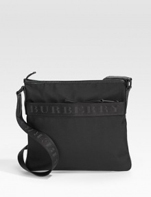 A slim and modern nylon bag for the man on the movie, finished with signature webbing across the front and crossbody strap. Zip closure Adjustable shoulder strap Exterior, interior zip pockets Signature lining 13W X 12½H X 1D Nylon Imported A slim and modern nylon bag for the man on the movie, finished with signature webbing across the front and crossbody strap. Zip closure Adjustable shoulder strap Exterior, interior zip pockets Signature lining 13W X 12½H X 1D Nylon Imported