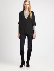 A boxy fit and a touch of stretch give this button-down cardigan universal appeal.V-neckElbow-length sleevesButton frontPatch pocketsDipped hemAbout 25 from shoulder to hem94% viscose/4% nylon/2% spandexDry cleanImported of Italian fabric Model shown is 5'10 (177cm) wearing US size Small. 