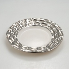 Precious metals and porcelain capture the timeless shifting of ocean, wind and sand into lasting impressions inspired by the dunes of Truro, Cape Cod. Precious metals and porcelain capture the timeless shifting of ocean, wind and sand into lasting impressions inspired by the dunes of Truro, Cape Cod.