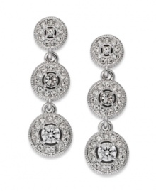 Terrific in triplicate. This pair of three-circle drop earrings from Eliot Danori is crafted from rhodium-plated brass. Crystal and cubic zirconia accents add a lustrous touch. Approximate drop: 1 inch. Terrific in triplicate. This pair of three-circle drop earrings from Eliot Danori is crafted from rhodium-plated brass. Crystal and cubic zirconia accents add a lustrous touch. Approximate drop: 1 inch.