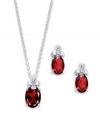 Crimson chic! Victoria Townsend's beautiful earrings and matching pendant feature oval-cut garnet (3-3/8 ct. t.w.) topped by a trio of sparkling diamond accents. Crafted in sterling silver. Approximate length: 18 inches. Approximate drop (pendant): 1/2 inch. Approximate drop (earrings): 1/2 inch.