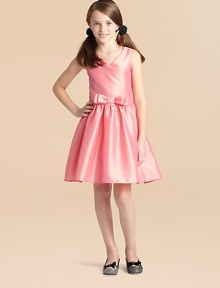 Rendered in eye-catching taffeta, this simply elegant v-neck frock features a pretty bow detail and full skirt, perfect for twirling and dancing the night away.V-neckSleevelessBack zipperBanded waist with bowFull skirtFully linedPolyesterDry cleanMade in the USA Rendered in eye-catching taffeta, this simply elegant v-neck frock features a pretty bow detail and full skirt, perfect for twirling and dancing the night away.V-neckSleevelessBack zipperBanded waist with bowFull skirtFully linedPolyesterDry cleanMade in the USA