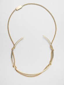 An artful statement, conceived to catch the eye with a simple tubular collar wrapped up in a bold chain.BrassLength, about 28Drop, about 5Push-lock claspMade in Italy An artful statement, conceived to catch the eye with a simple tubular collar wrapped up in a bold chain.BrassLength, about 28Drop, about 5Push-lock claspMade in Italy