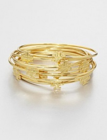 Stacked set of ten bangles with goldplated logo medallions for a simple, layered look. 16K goldplated brassDiameter, about 2½Slip-on styleImported Stacked set of ten bangles with goldplated logo medallions for a simple, layered look. 16K goldplated brassDiameter, about 2½Slip-on styleImported