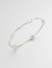 From the Rock Candy® Collection. Five faceted blue topaz stations set on a hammered sterling silver bangle. Blue topazSterling silverDiameter, about 2.5Slip-on styleImported From the Rock Candy® Collection. Five faceted blue topaz stations set on a hammered sterling silver bangle. Blue topazSterling silverDiameter, about 2.5Slip-on styleImported