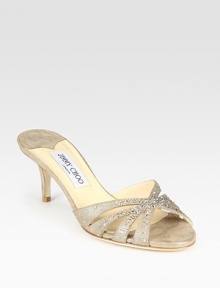 Fairytale-inspired metallic leather silhouette with glitzy rhinestone embellishments. Self-covered heel, 2½ (65mm)Metallic leather upperLeather lining and solePadded insoleMade in ItalyOUR FIT MODEL RECOMMENDS ordering one half size up as this style runs small. 