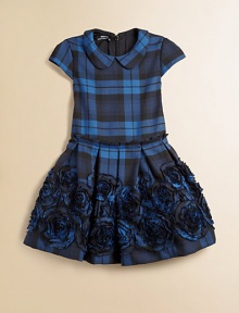 She'll be mad about plaid in this tartan-inspired frock with Peter Pan collar, pleated waistband and full, embroidered skirt.Peter Pan collarCap sleevesBack zipperPleated waistFull skirt with rosettes65% polyester/35% viscoseDry cleanImported