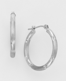 The classic hoop earring in cool white gold. 14k white gold hoop is diamond cut for extra glimmer. Wire-catch closure. For pierced ears only. The classic hoop earring in cool white gold. 14k white gold hoop is diamond cut for extra glimmer. Wire-catch closure. For pierced ears only.
