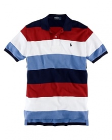 Rendered in breathable cotton mesh, a classic-fitting polo shirt is accented with bold stripes for a handsome, athletic look. Rendered in breathable cotton mesh, a classic-fitting polo shirt is accented with bold stripes for a handsome, athletic look.