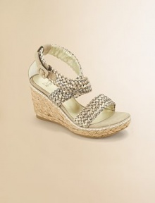 Straps of richly woven raffia with a glowing metallic finish on an of-the-moment rope-covered wedge.Woven raffia upperCrisscross buckle ankle strapRope-covered composite rubber wedge heel and soleMetallic faux leather liningImported Straps of richly woven raffia with a glowing metallic finish on an of-the-moment rope-covered wedge.Woven raffia upperCrisscross buckle ankle strapRope-covered composite rubber wedge heel and soleMetallic faux leather liningImported