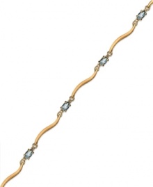 Cool blue. Victoria Townsend's stunning bracelet combines oval-cut blue topaz (1-5/8 ct. t.w.) and diamond accents in 18k gold over sterling silver. Approximate length: 7-1/4 inches. Cool blue. Victoria Townsend's stunning bracelet combines oval-cut blue topaz (1-5/8 ct. t.w.) and diamond accents in 18k gold over sterling silver. Approximate length: 7-1/4 inches.