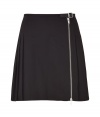 Coquettish yet full of edge, this pleated skirt from McQ Alexander McQueen gets a sexy kick with an exposed front zip - Flat front with buckle detail at waist and asymmetrical zip, pleated back, mini-length - Wear with a silk blouse, a blazer, and platform heels