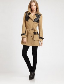 The classic double-breasted trench, updated with sleek leather trim for a modern-day spin.Notch collarDouble-breasted button frontBelted cuffsSelf-beltFlap and patch pocketsBack zip-ventAbout 32 from shoulder to hemCottonDry cleanImportedModel shown is 5'9 (175cm) wearing US size Small. The classic double-breasted trench, updated with sleek leather trim for a modern-day spin.Notch collarDouble-breasted button frontBelted cuffsSelf-beltFlap and patch pocketsBack zip-ventAbout 32 from shoulder to hemCottonDry cleanImportedModel shown is 5'9 (175cm) wearing US size Small.