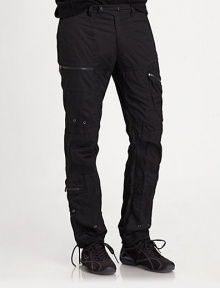 Metal zippers and grommets give a modern moto-inspired look to an essential cargo pant in lightweight cotton poplin. Belted waist with a double-snap closureAdjustable snap tabs at the side waist for a custom fitAllover silvertone grommets, zipper pulls and snapsTwo zip cargo pockets on each leg and two on the back waistRibbed-knit hem with drawcords for an adjustable fitInseam, about 32CottonMachine wash