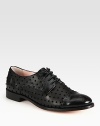 Classically styled leather oxford fashioned with velour polka dots and patent leather trim. Stacked heel, 1 (25mm)Leather, patent leather and velour upperLeather lining and solePadded insoleMade in Italy