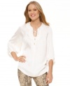 Be relaxed while looking your best. This embellished peasant blouse from Vince Camuto boasts a voluminous shape that flatters in white for Spring.