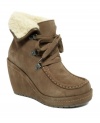 With their tied-up laces and foldover cuff, Rocket Dog's Bonfire booties add cozy charm to fall fashion. In addition to topstitch detailing, they include a trendy covered wedge heel and platform sole.