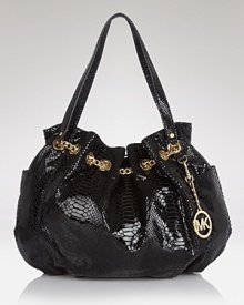 MICHAEL Michael Kors' luxe take all-American style proves casual with this roomy straw tote. Whether as a beach bag or at-work carryall, this bag has a practical ring to it. MICHAEL Michael Kors' luxe take all-American style proves casual with this roomy straw tote. Whether as a beach bag or at-work carryall, this bag has a practical ring to it.