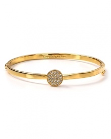 Hit the bright spot with this kate spade new york bangle, cast in gold plate with a striking crystal stone station.