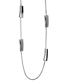 Polish your look with chic, contemporary accessories. Nine West's unique style transitions effortlessly from day to night. Set in silver tone mixed metal with long station beads. Approximate length: 36 inches.