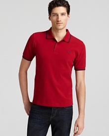 Widely known as the pioneer of Mod, British street fashion, Fred Perry polos have become an iconic fashion silhouette. A sporty polo with contrast double stripe trim and embroidered logo at left chest. Widely known as the pioneer of Mod, British street fashion, Fred Perry polos have become an iconic fashion silhouette. A sporty polo with contrast double stripe trim and embroidered logo at left chest.