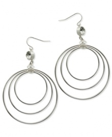 A trio of hoops in differing sizes complement the shimmering crystal accents and Quatro G logo charms on these earrings from GUESS. Crafted in silver tone mixed metal. Approximate drop: 2-3/4 inches. Approximate diameter: 2 inches. A trio of hoops in differing sizes complement the shimmering crystal accents and Quatro G logo charms on these earrings from GUESS. Crafted in silver tone mixed metal. Approximate drop: 2-3/4 inches. Approximate diameter: 2 inches.