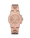 This gleaming rose-gold tone watch from MICHAEL Michael Kors captures modern, sporty style. Features include three-eye functionality and date window.