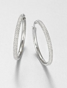From the Brilliance Collection. The design is simple but the look is shimmering in these slender hoops set with rows of dazzling rhinestones.GlassSilvertoneDiameter, about 1.25PiercedImported From the Brilliance Collection. The design is simple but the look is shimmering in these slender hoops set with rows of dazzling rhinestones.GlassSilvertoneDiameter, about 1.25PiercedImported