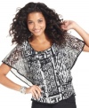 A femme silhouette and bold black-and-white print combine for a stunning effect on ECI's latest top.