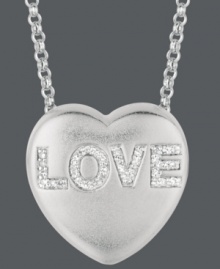Say it loud and clear. Sweethearts' adorable heart-shaped pendant expresses more that just great style with the word LOVE written in round-cut diamonds (1/10 ct. t.w.) across the surface. Pendant crafted in sterling silver. Copyright © 2011 New England Confectionery Company. Approximate length: 16 inches + 2-inch extender. Approximate drop: 5/8 inch. Say it loud and clear. Sweethearts' adorable heart-shaped pendant expresses more that just great style with the word LOVE written in round-cut diamonds (1/10 ct. t.w.) across the surface. Pendant crafted in sterling silver. Copyright © 2011 New England Confectionery Company. Approximate length: 16 inches + 2-inch extender. Approximate drop: 5/8 inch.