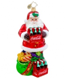 Santa Claus pops open the perfect gift – two six packs of Coca-Cola for delicious and refreshing holidays. With brilliant detail, from the holly in his hat to the bells on his bag, it's an essential ornament for Christopher Radko collectors.