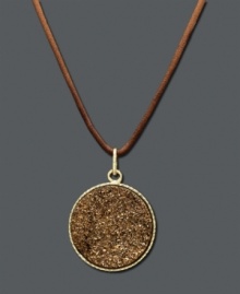 Rich design featuring warm, earthy hues. This naturally appealing necklace features a 14k gold setting and bail with a sparkling bronze drusy decoration at center. Pendant suspended from a brown knotted cord. Approximate length: 20 inches. Approximate drop: 1-1/5 inches.