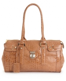 A glossy look fit for a socialite. This Ivanka Trump satchel features gleaming goldtone hardware, a signature charm and protective bottom feet. A glossy look fit for a socialite. This Ivanka Trump satchel features gleaming goldtone hardware, a signature charm and protective bottom feet.