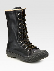The best way to beat the cold is in high style. Complete your stylish cold-weather ensemble with this tall lace-up boot, constructed from leather with a sturdy rubber sole and a wool lining for long-lasting warmth and comfort.LeatherPadded insoleRubber soleImported The best way to beat the cold is in high style. Complete your stylish cold-weather ensemble with this tall lace-up boot, constructed from leather with a sturdy rubber sole and a wool lining for long-lasting warmth and comfort.LeatherPadded insoleRubber soleImported