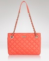 Bold hues are big news for spring. In quilted coral leather, kate spade new york's satchel packs a tropical punch that's totally on-trend.