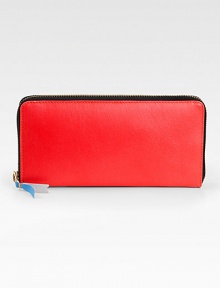 A sleek continental design with a vibrant leather exterior and multicolored inside panels.Zip closureOne inside snap pocketThree bill slotsSix credit card slotsLeather lining8W X 4H X 1D Imported A sleek continental design with a vibrant leather exterior and multicolored inside panels.Zip closureOne inside snap pocketThree bill slotsSix credit card slotsLeather lining8W X 4H X 1D Imported