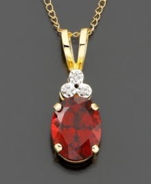 An elegant look created by three diamond accents atop a rich oval-cut garnet (1-3/4 ct. t.w.). Set in 14k gold. Chain measures 18 inches; drop measures 3/4 inch. An elegant look created by three diamond accents atop a rich oval-cut garnet (1-3/4 ct. t.w.). Set in 14k gold. Chain measures 18 inches; drop measures 3/4 inch.