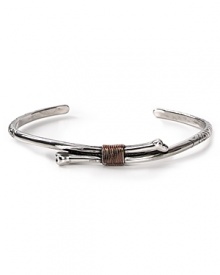 Add a touch of downtown cool to your jewelry collection with this engraved silver-plated bone cuff with rose gold wire wrapping. Add a touch of downtown cool to your jewelry collection with this engraved silver-plated bone cuff with rose gold wire wrapping.