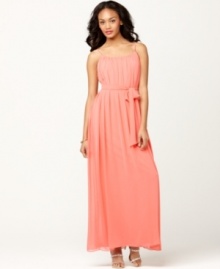 Calvin Klein's dress is radiant with a bright hue, gauzy chiffon and feminine details, like a self-tie belt at the waist and crisscrossing straps at the back. Calvin Klein's dress is radiant with a bright hue, gauzy chiffon and feminine details, like a self-tie belt at the waist and crisscrossing straps at the back.