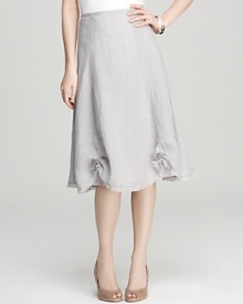 Clever pull cords add an offbeat burst of texture to this Eileen Fisher skirt. Pair with nude heels and a cropped cardigan for summertime office attire. Clever pull cords add an offbeat burst of texture to this Eileen Fisher skirt. Pair with nude heels and a cropped cardigan for summertime office attire.