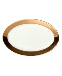 Strike gold. A wide band of brilliant gold contrasts white bone china in Cru's Monaco oval platter for magnificent fine dining. Strike gold. A wide band of brilliant gold contrasts white bone china in Cru's Monaco oval platter for magnificent fine dining.